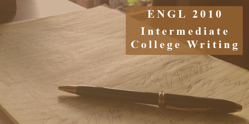 ENGL 2010 Announcement banner, pen resting on used notepad