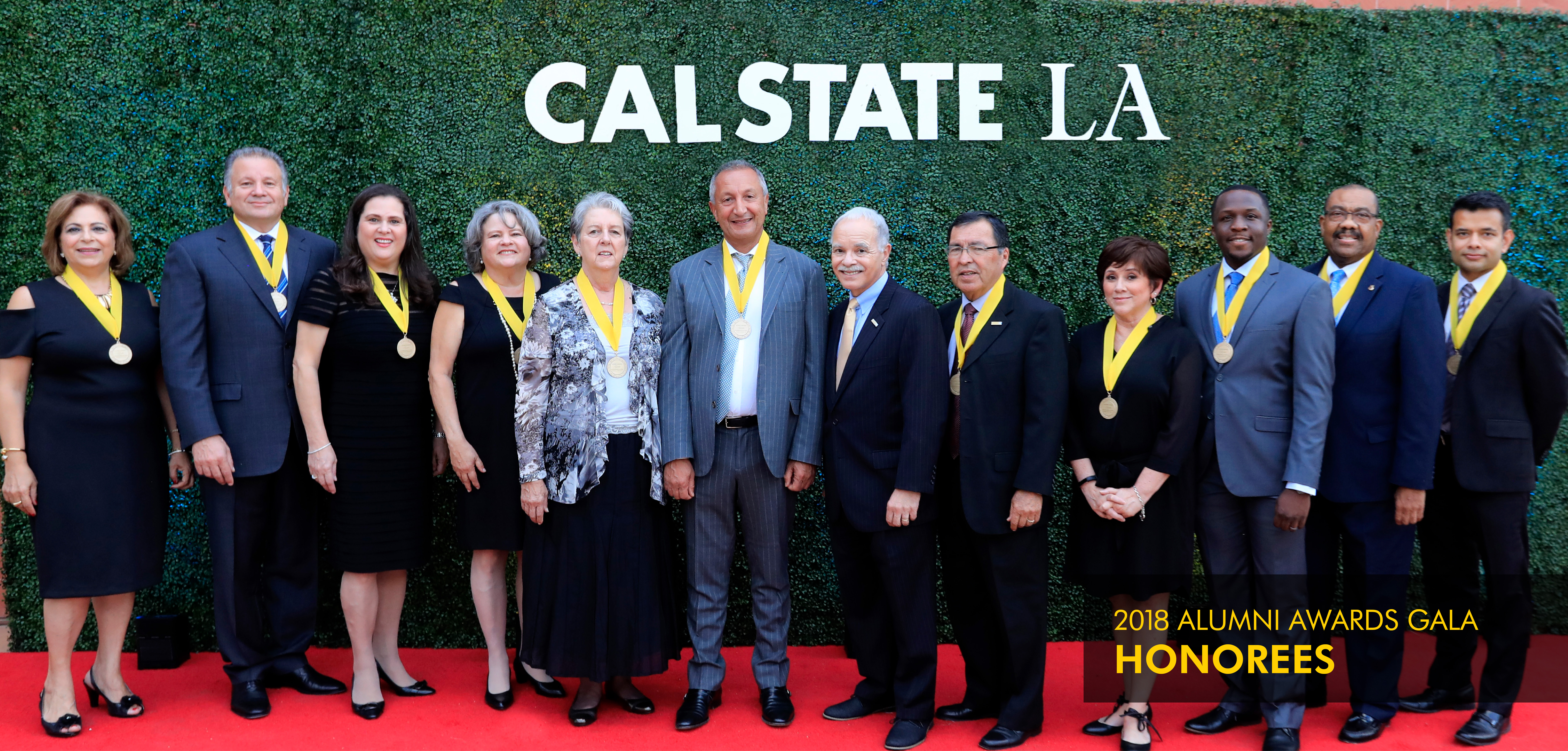 Group of Alumni Awards Gala honorees with President Covino
