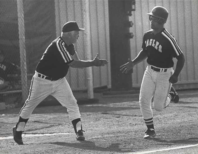 John Herbold, left cheers on a player after a homerun versus Montclair State in this archive photo from 1990.