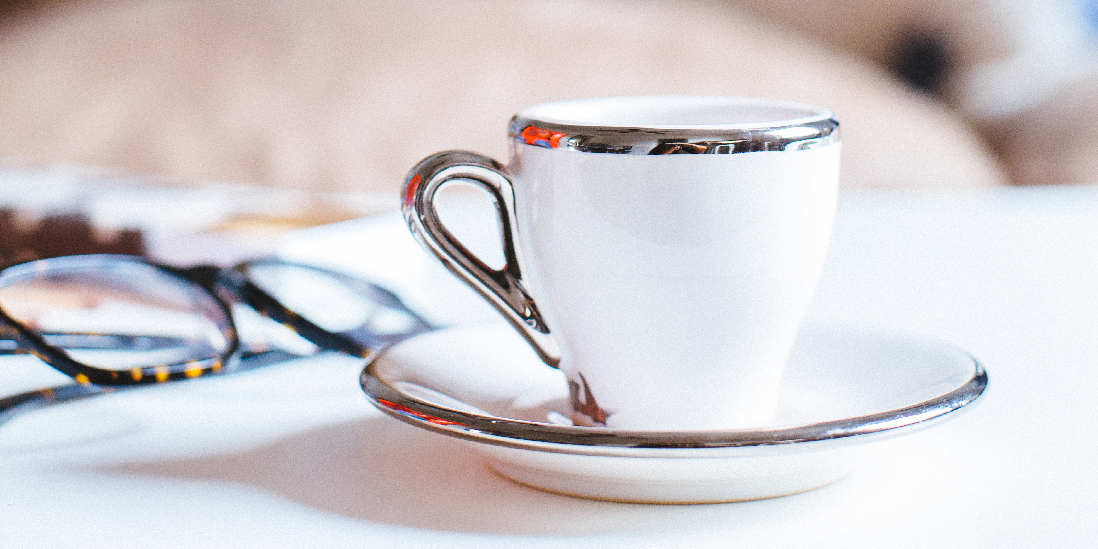 Cup of coffee and saucer on a table