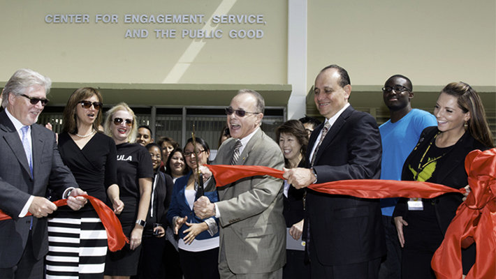 President Covino cuts the ribbon at the grand opening of the Center for Engagement, Service, and the Public Good.