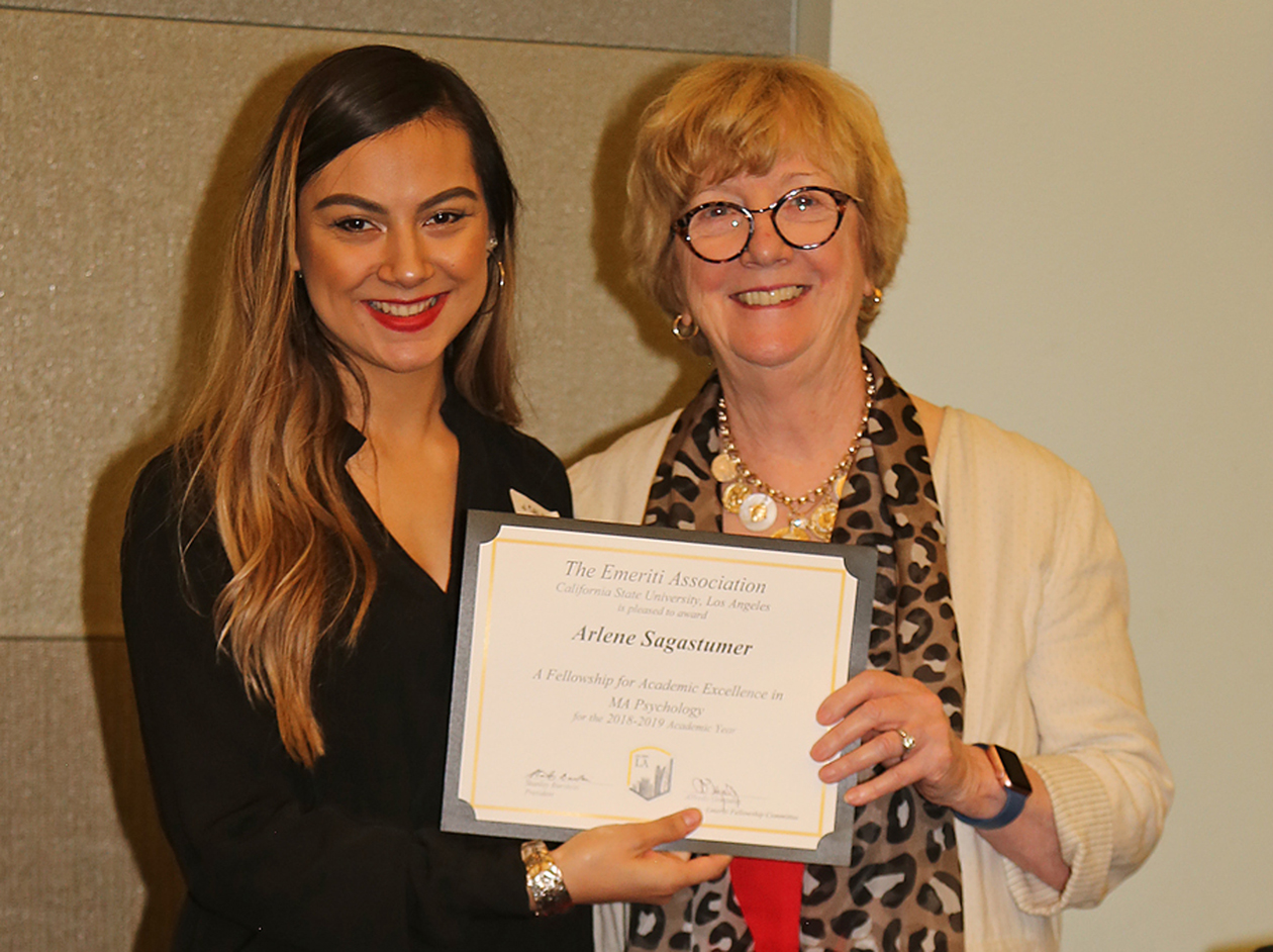 Arlene Sagastumer, student, with professor presenting award