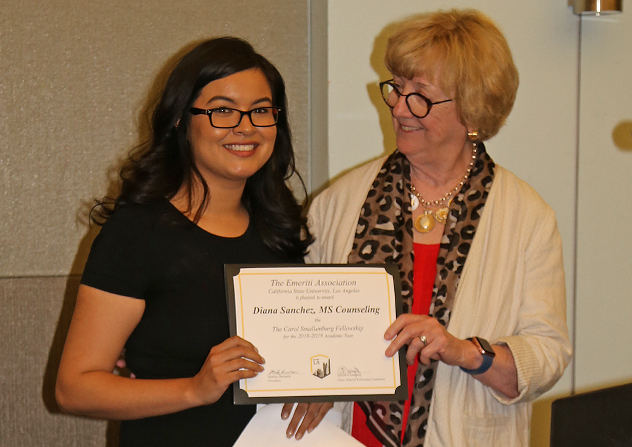 Diana Sanchez, student, with professor presenting award