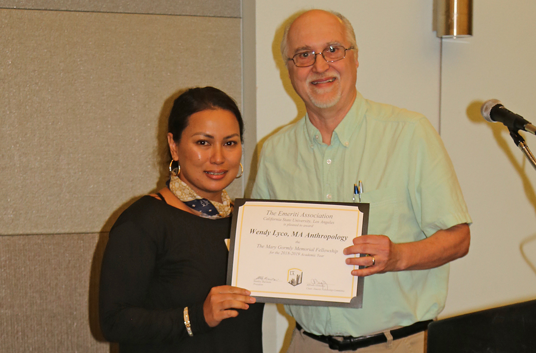 Wendy Lyco, student, with professor presenting award