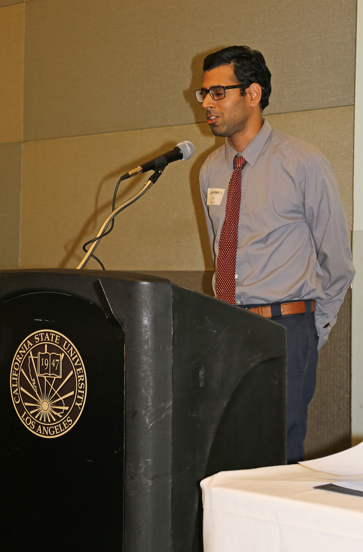 male Student at podium at fall luncheon