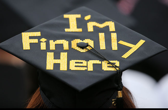Graduation cap with "I'm finally here" spelled out in Legos.