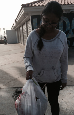 CSULA Student with some of the "harvest" at beach clean-up
