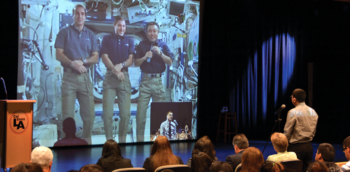 Students talk with NASA astronauts in a intergalactic conference call.