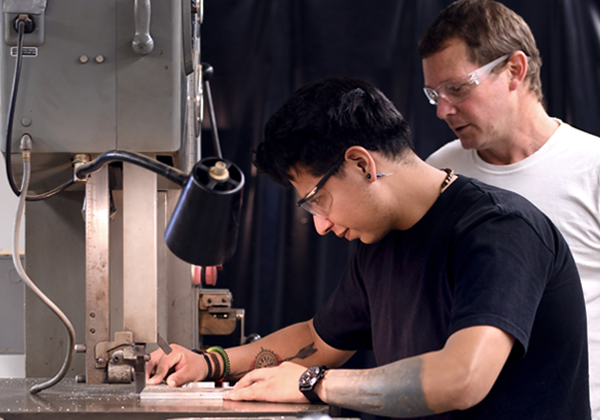faculty helps student machining