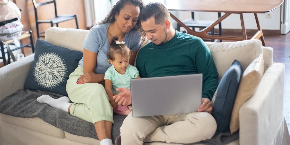 Family on couch with laptop