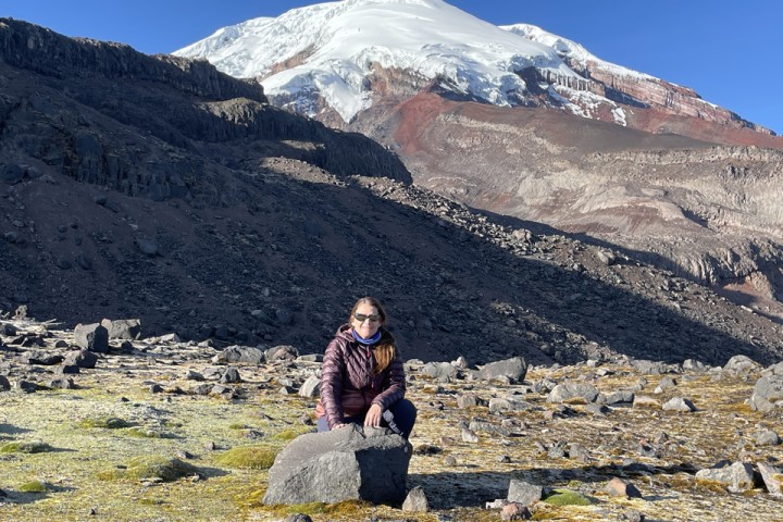 Cal State LA Professor Jennifer Garrison sits in front of a large mountain.