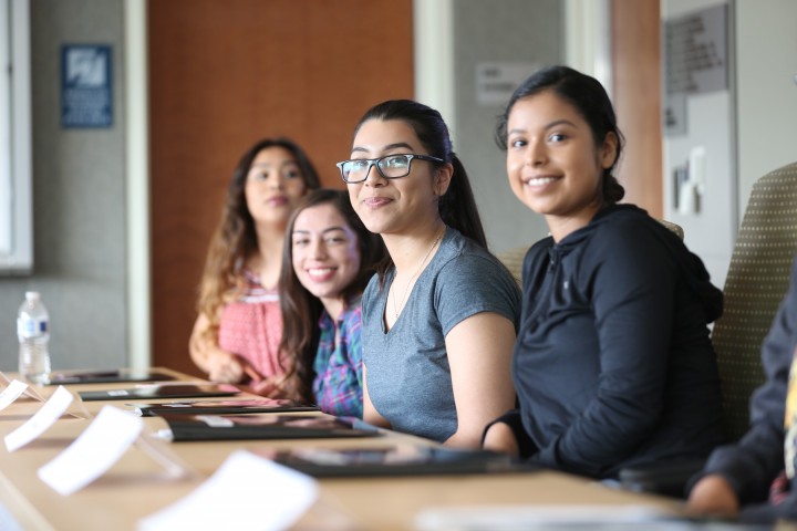 Students posing in classroom. 