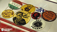 A selection of pins from the Gloria Arellanes Papers