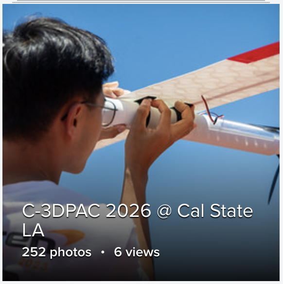 Flickr album cover showing student aiming UAV to blue sky