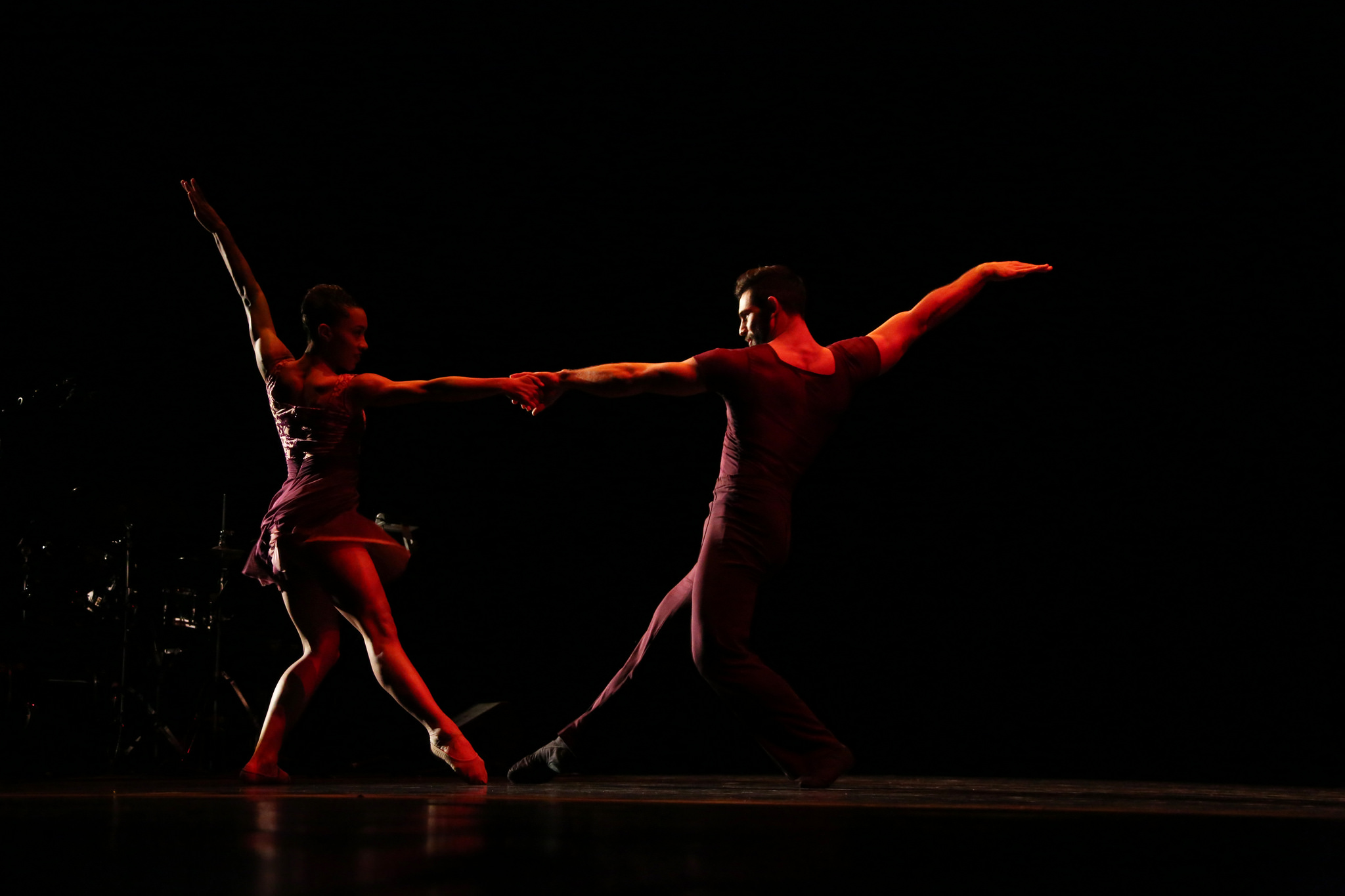 Dancers from Ballet Hispánico perform a duet onstage. 