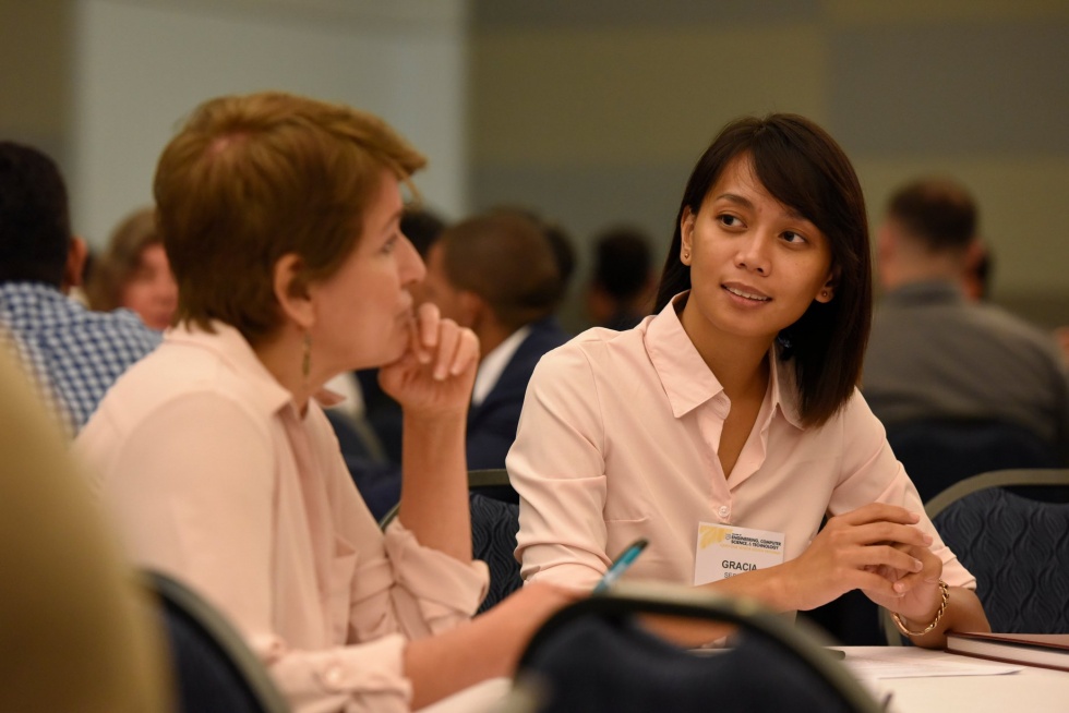 Female student engaged in conversation at Capstone Senior Design Launch 2018-19