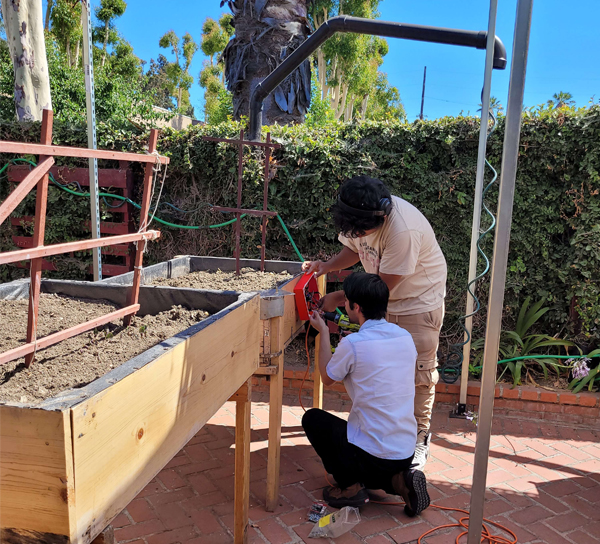 BOOST student Installing gardening project