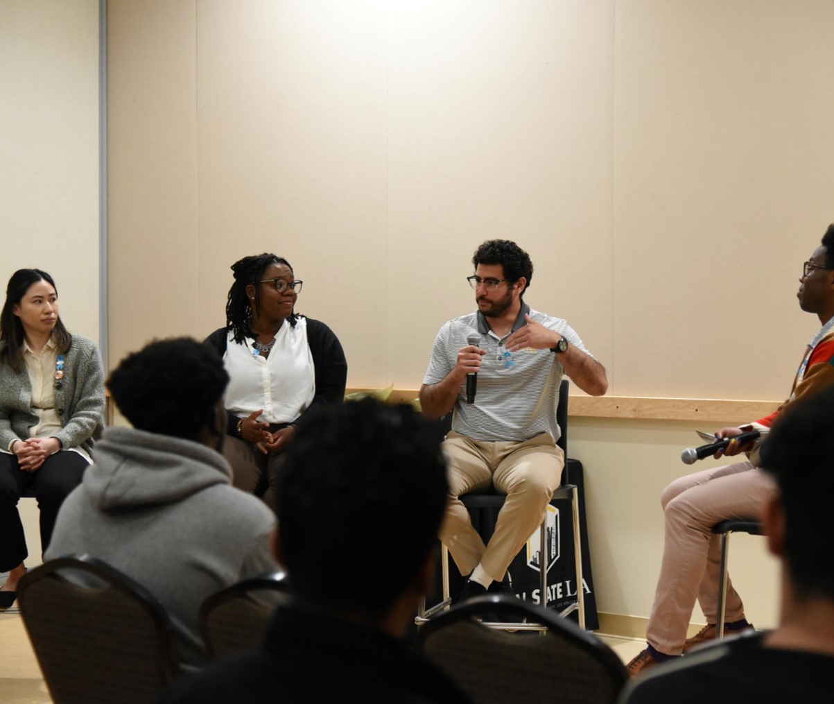 People sitting in chairs talking 