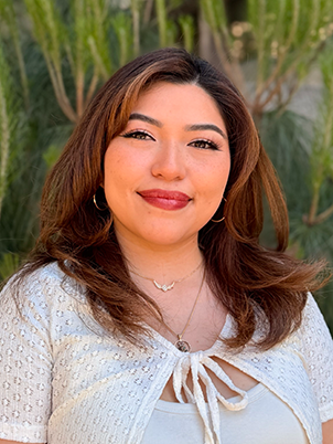 Person smiling with long hair