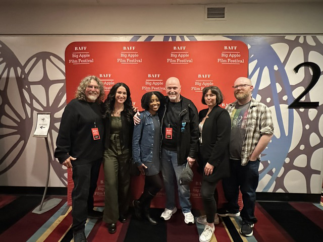 Stephen Rothman, left, poses with five attendees at the Big Apple Film Festival in New York.