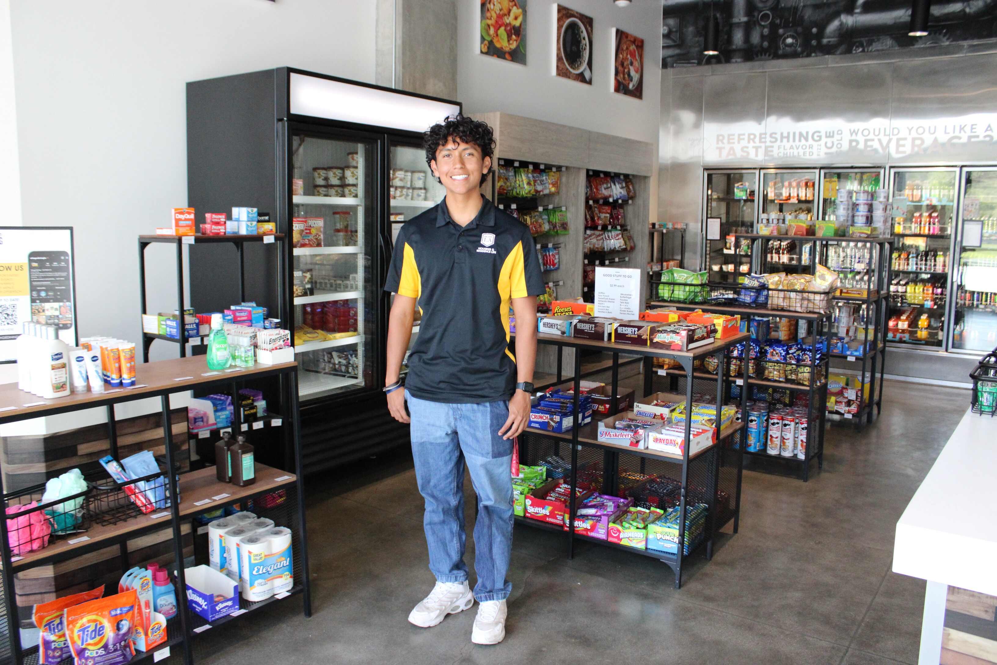 Cal State LA student standing in the Village Marking convenience store in Housing.