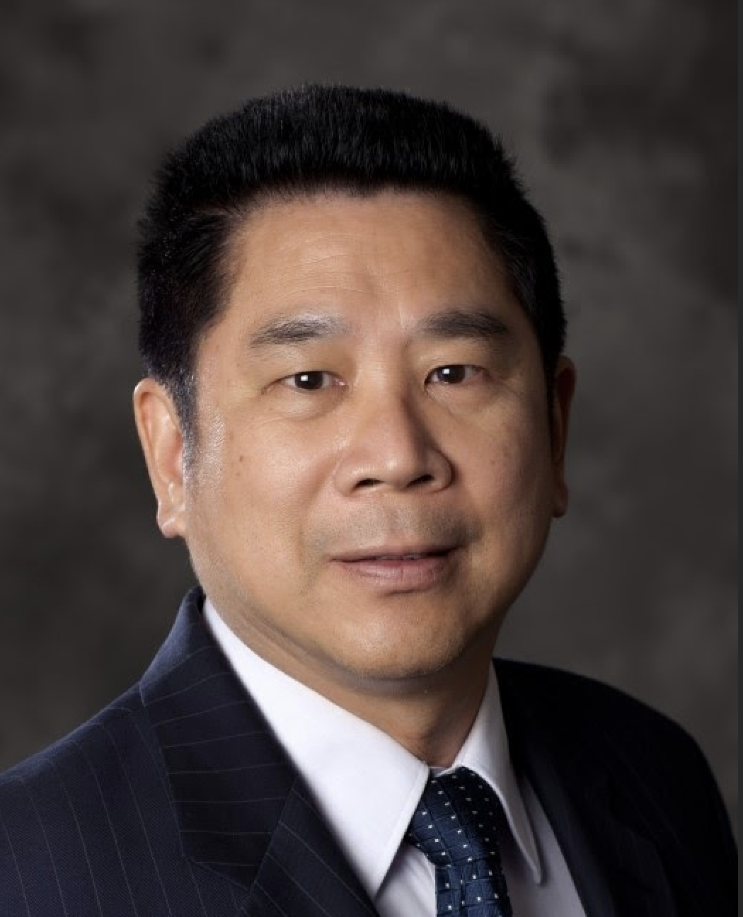 Jay Kuo wearing a dark suit