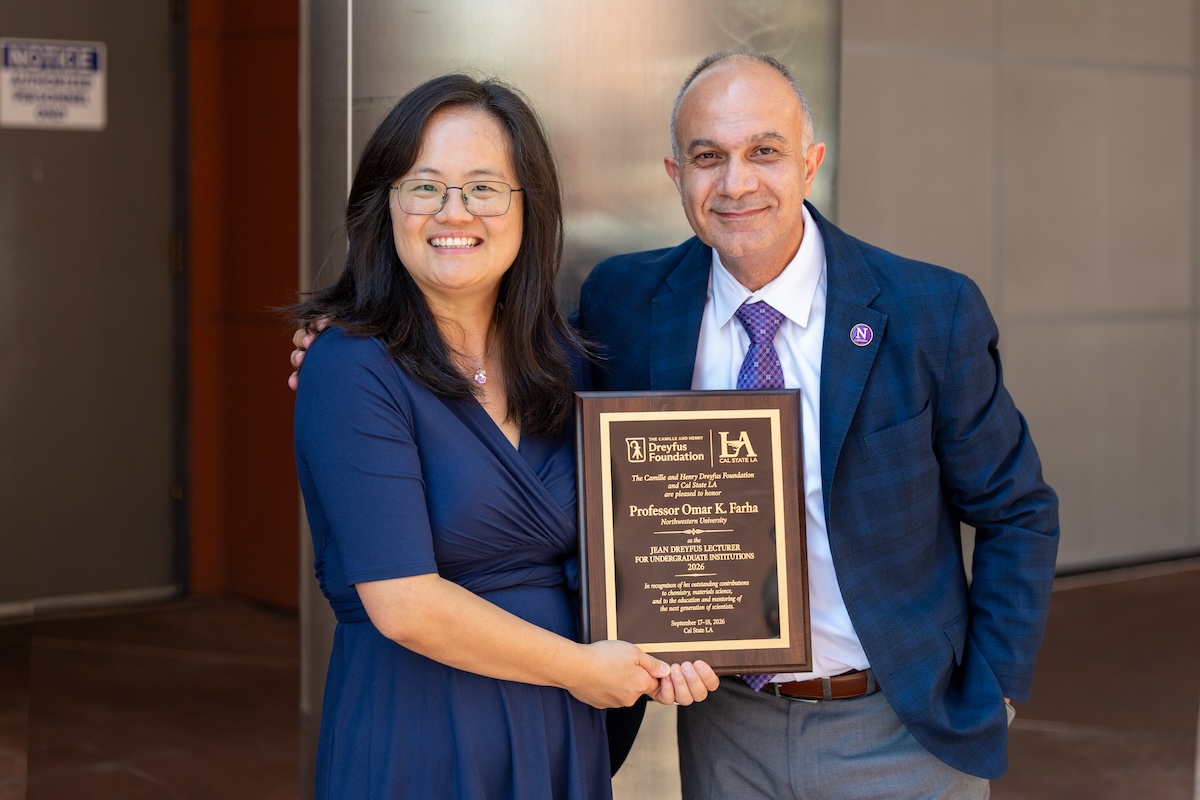 Northwestern University professor Omar K. Farha (right) and Cal State LA chemistry faculty member Yangyang Liu (left) smile while holding a commemorative plaque recognizing Farha's participation in the 2026 Jean Dreyfus Lectureship at Cal State LA.