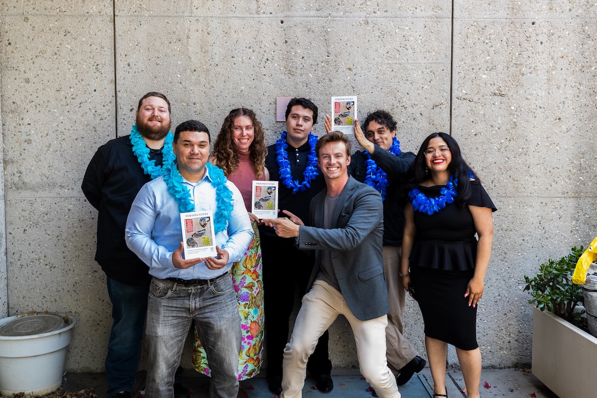 Group of people posing for photo