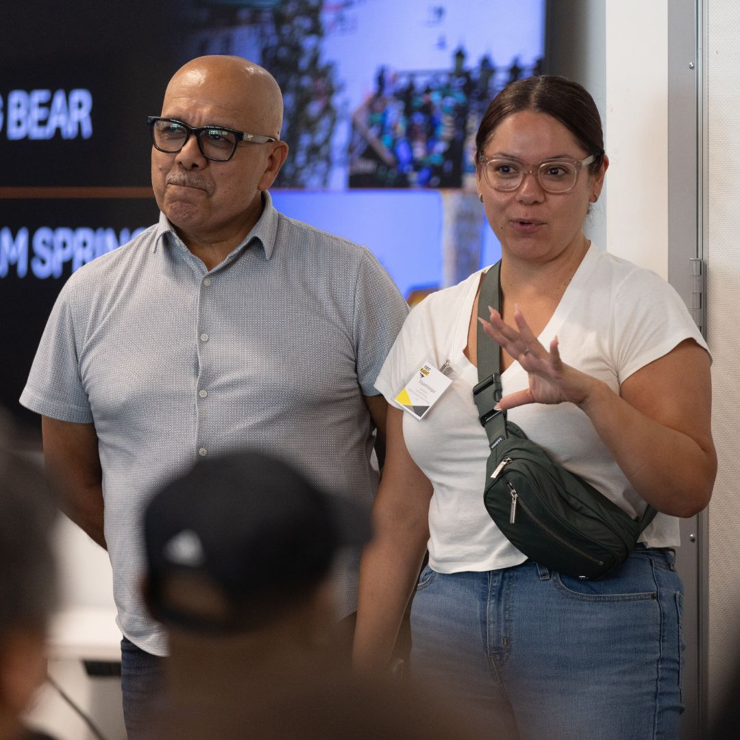 A man and woman speaking