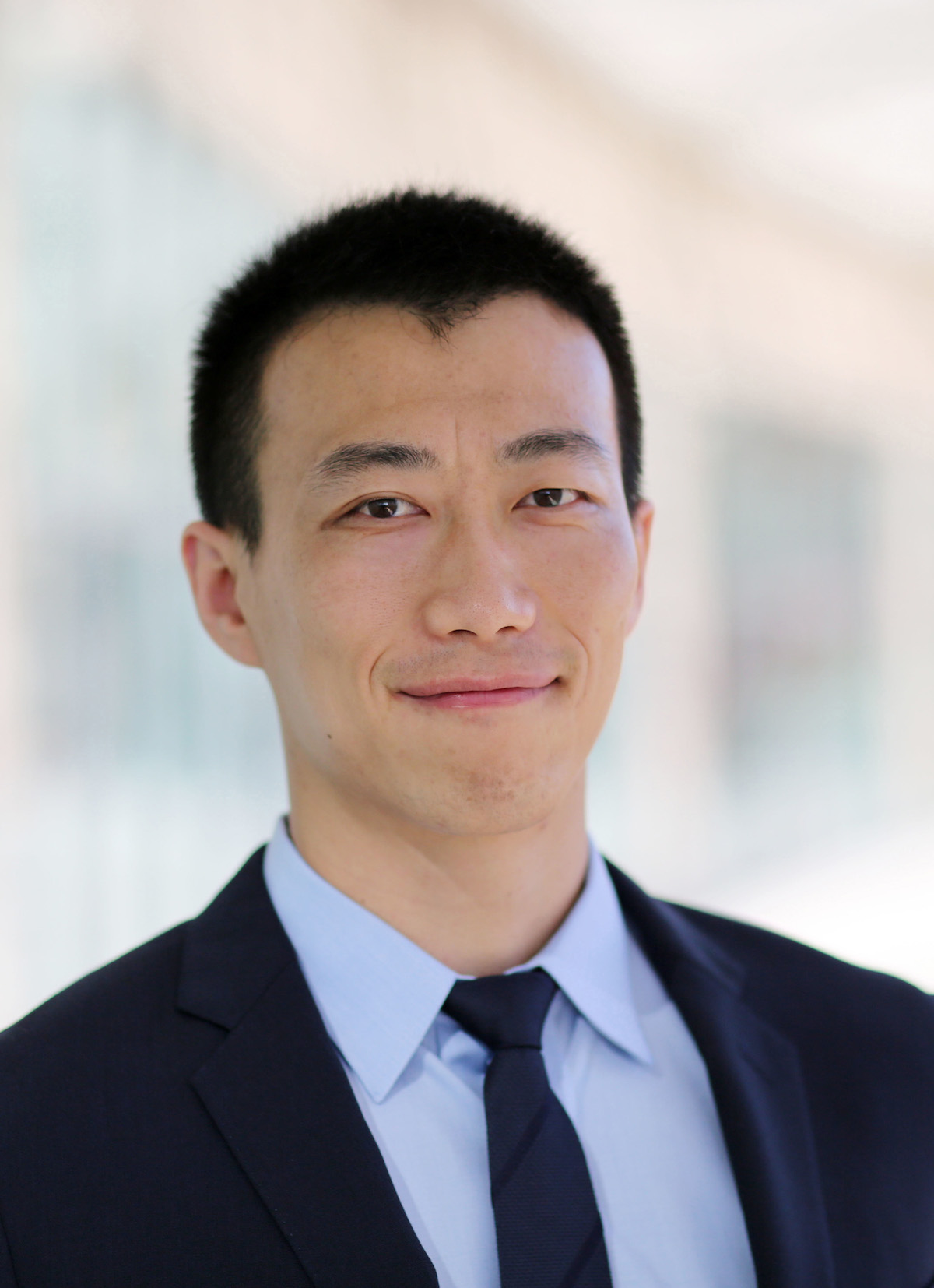 Mu Wu wearing a suit