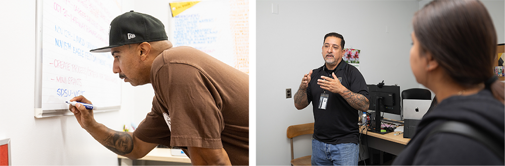 A student bending down to write on a dry erase board. A staff person speaking while a student listens.