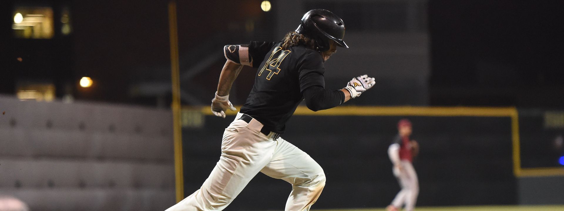Baseball player running to first base