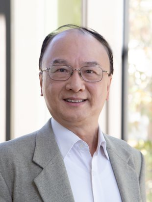 Thomas Y Hou wearing a gray suit