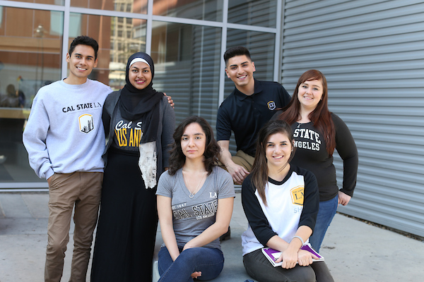 Group shot of six smiling students wearing Cal State LA attire