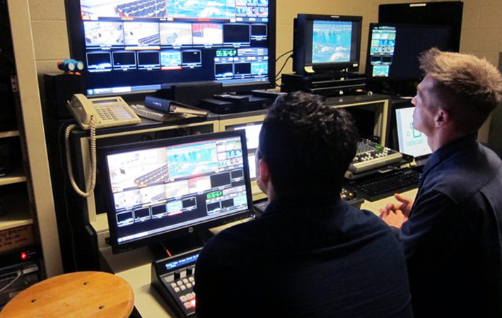 Student Kaveh Aflakian shadows alumnus Randy Ishino, a community TV producer for Monterey Park.