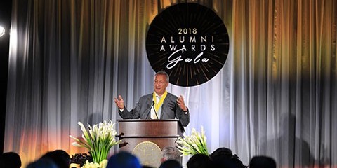 Person speaks at podium at 2018 Alumni Awards Gala