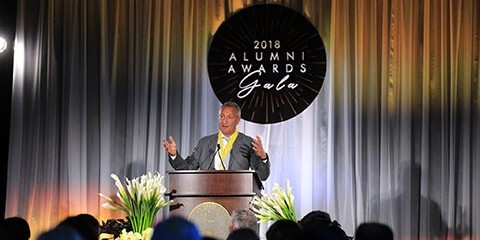 Person speaks at podium at 2018 Alumni Awards Gala