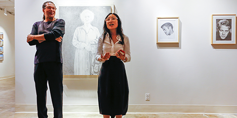 Exhibition curator Mark Steven Greenfield and Professor Mika Cho, director of the Fine Arts Gallery, next to several Kent Twitchell sketches.
