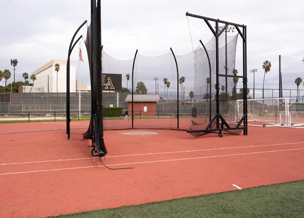 A discus cage on a field.
