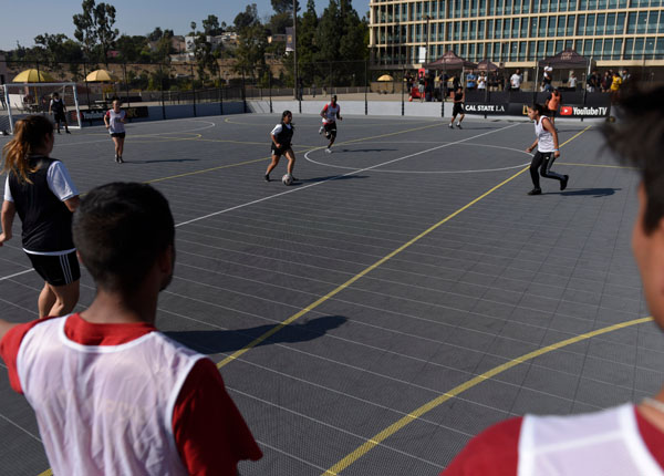 Student playing soccer.