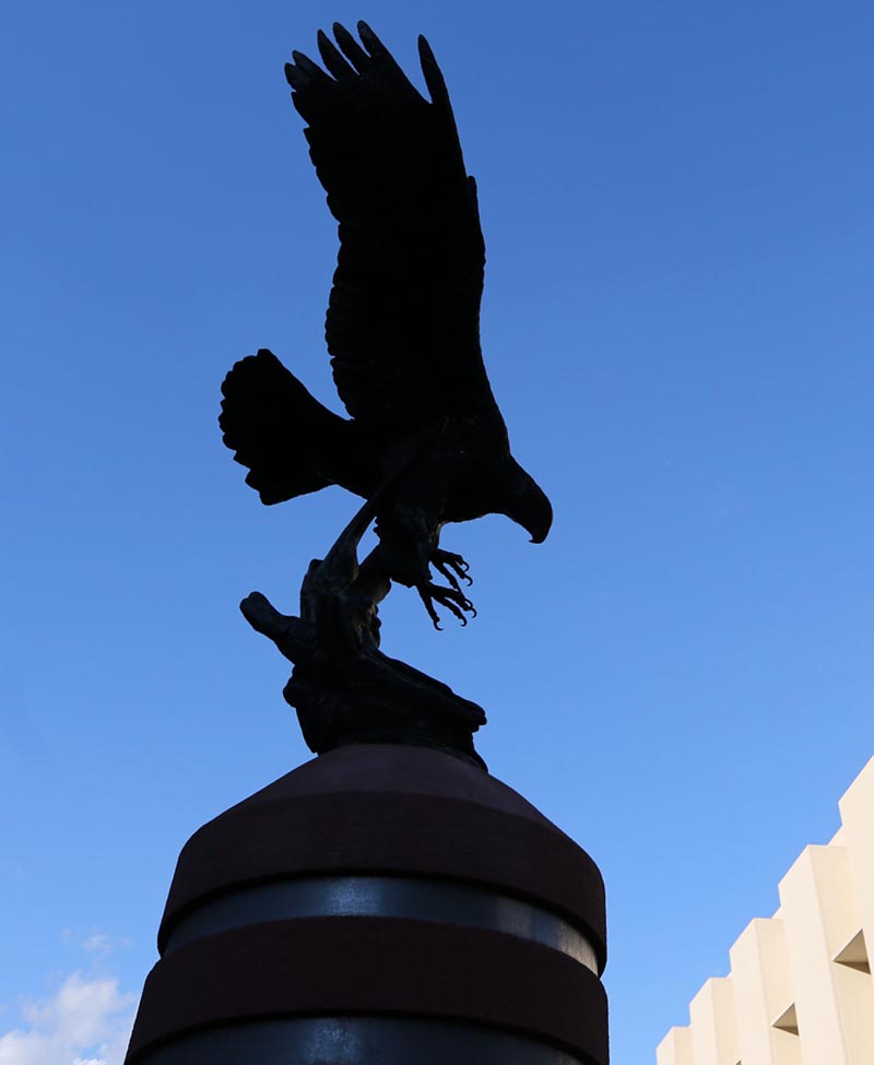 A statue of a Golden Eagle flying.