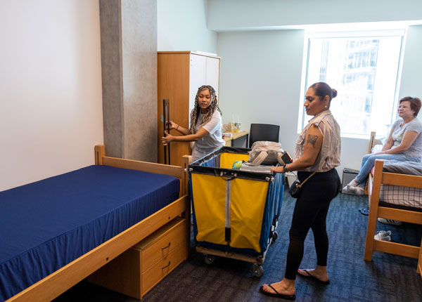 A student setting up their dorm room.