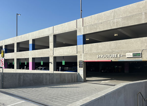 The entrance to a large parking structure.