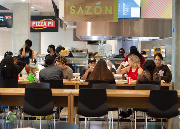 People sitting at a table eating.