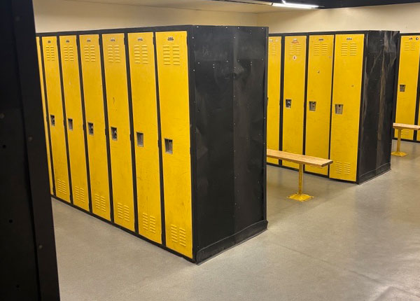 Yellow lockers in a locker room.