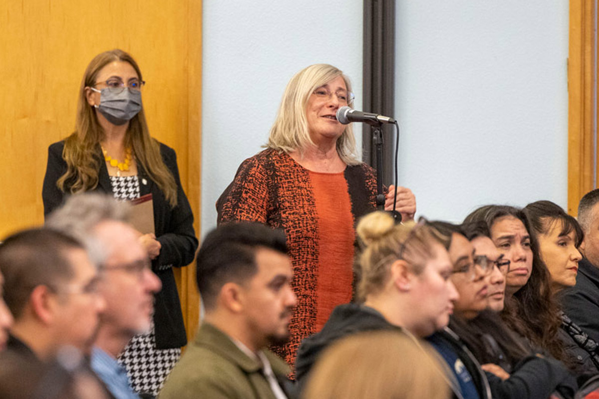 A community member speaking into a microphone.