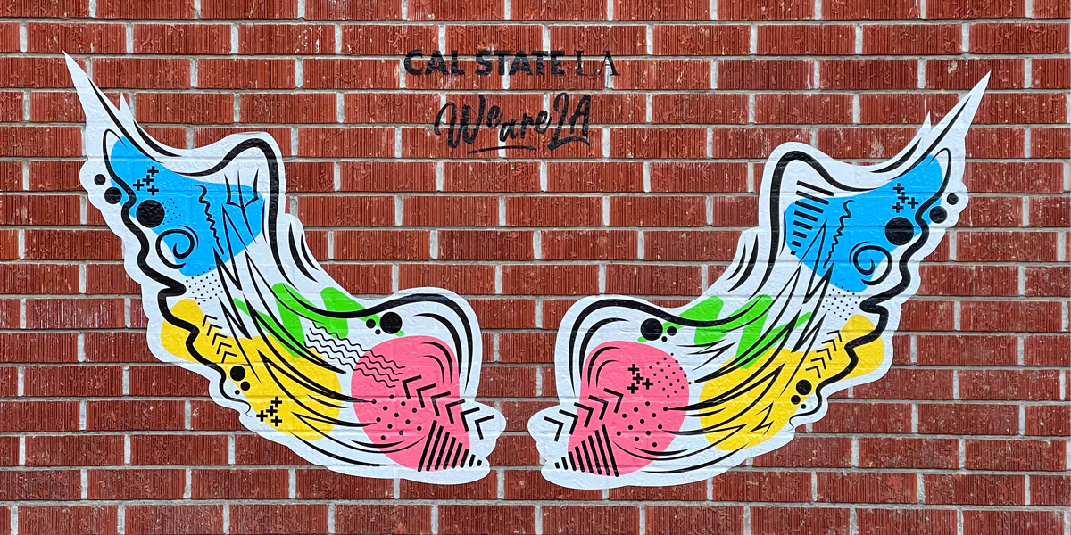 Artistic interpretation of wings on a brick wall in front of the ECST building.