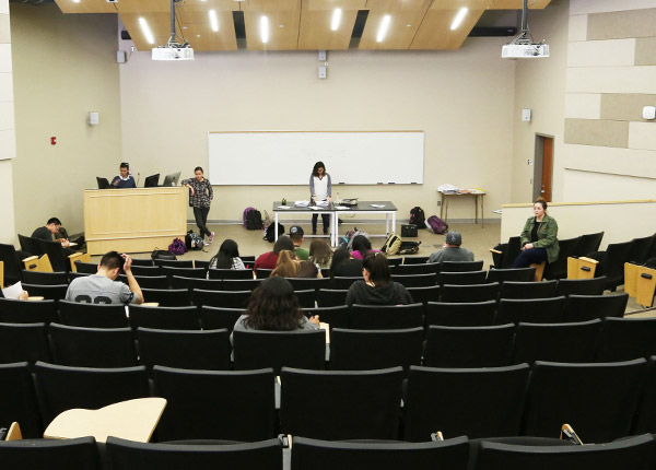 A large conference room with stadium-like seating.