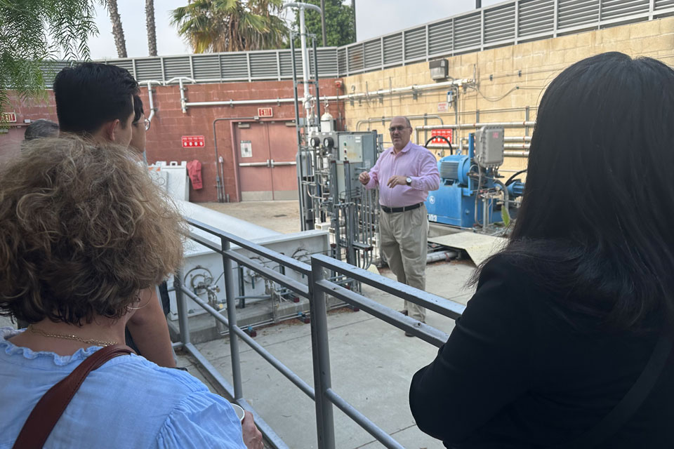 Dr Blekhman explains H2 station to tour group