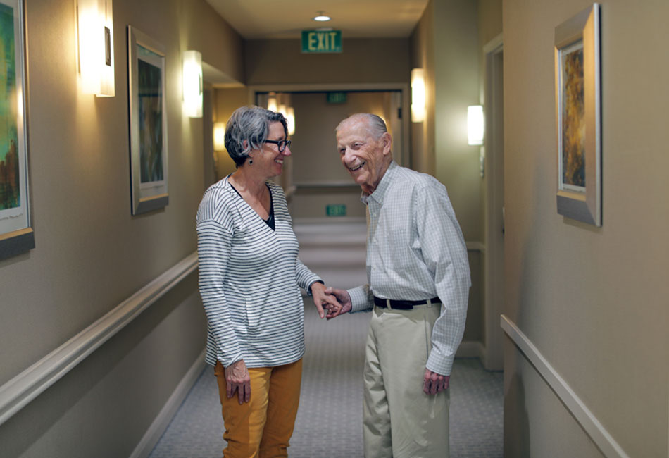 Photo: Sigmund Burke and his daughter, Robin Berkovitz, share a moment. (Credit: J. Emilio Flores/Cal State LA)